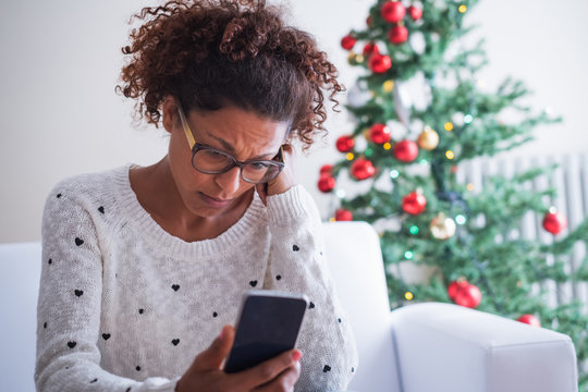 Worried black woman at home on christmas holiday