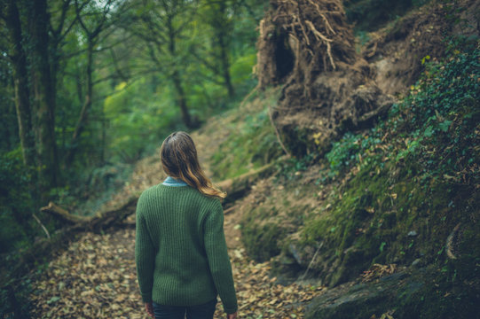 Young woman walking in the woods