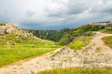 View of canyon with rocks and caves Murgia Timone, Matera Sassi, Italy