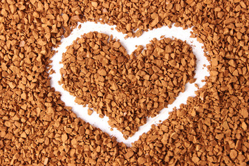  instant coffee background and painted heart. Love for coffee. Flavored coffee