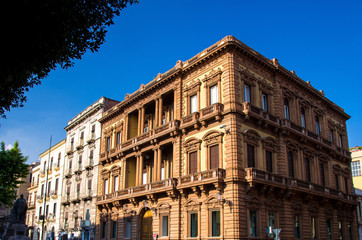 Fototapeta na wymiar Typical street and buildings in old style, Catania, Sicily, Italy
