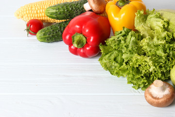 Set of different fresh vegetables on a wooden background. Diet, healthy food, veggie.