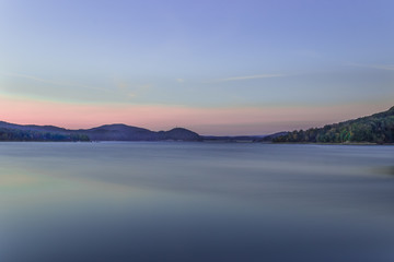 Sunset over the Solina Dam in Bieszczady Mountains area of south-eastern Poland. Long-exposure image.