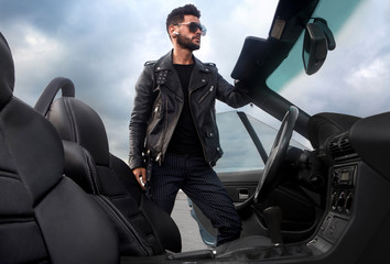 Handsome man near the car. Businessman.