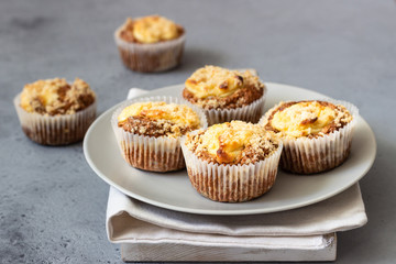 Fresh homemade muffins with cream cheese filling and streusel.