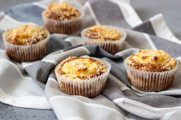 Fresh homemade muffins with cream cheese filling and streusel.