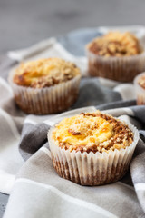 Fresh homemade muffins with cream cheese filling and streusel.