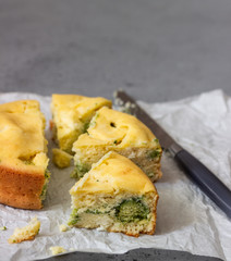 Corn cake with broccoli on parchment paper. 