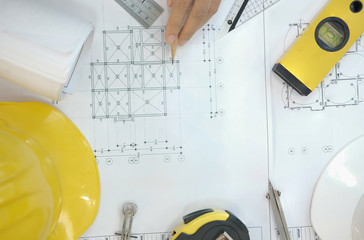 house blueprint of real estate project at architect engineer  workplace. building construction tool...