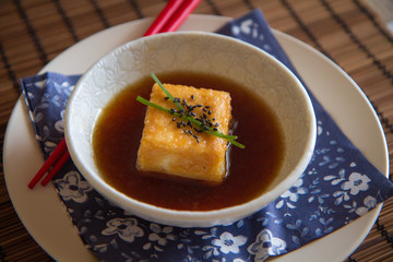 Agedashi tofu (deep friend tofu) in sauce with garnish