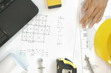 house blueprint of real estate project at architect engineer  workplace. building construction tool...