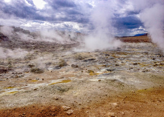 Stunning landscape of steaming ground, hot pots in Krýsuvík, Seltun in good sunny day with blue sky, Reykjanes Peninsula, Global Geopark, Geothermal active area on southwest of Iceland, Europe