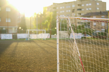 Children football team in  training at sunset 