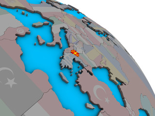 Macedonia with embedded national flag on simple blue political 3D globe.