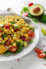 Sweet Corn salad with tomatoes, avocado, red onion, herbs and lime