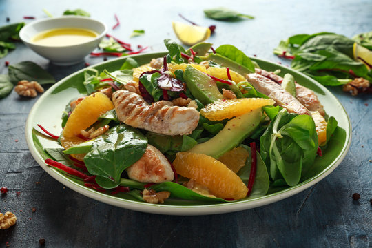 Grilled chicken with orange and avocado salad