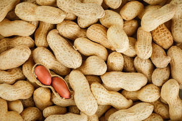 Peeled peanut on well peanuts. Peanuts, for background or textures.