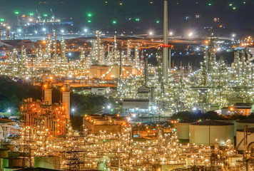 Fototapeta na wymiar The illumination of the refinery lamp at the beautiful night.Oil refining industry.Industrial city.