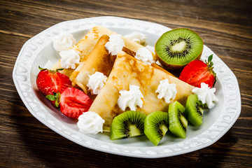 Crepes with fruit and creme
