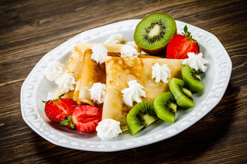 Crepes with fruit and creme