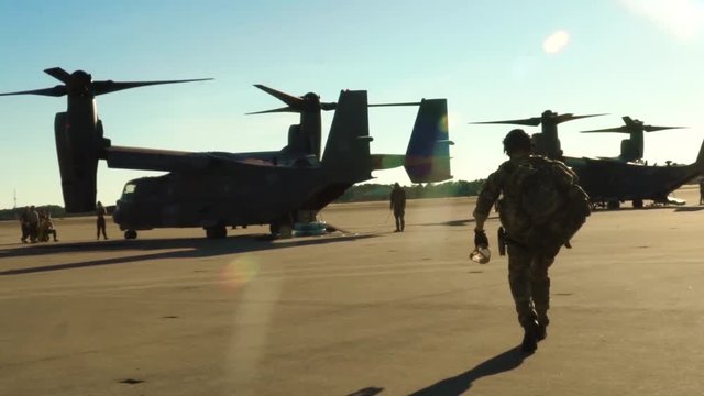 Soldier Timelapse on runway before boarding military aircraft 