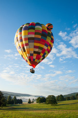 Naklejka premium Two multicoloured hot air balloons vertical