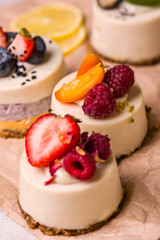 Cupcake with strawberries, raspberries, blueberries, close-up.