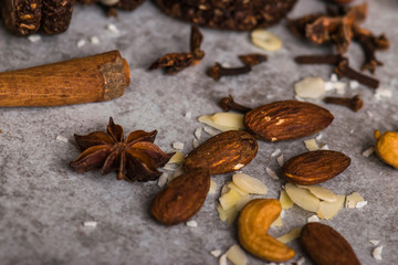 Nuts, cinnamon, coconut closeup on the table.