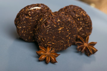 Brown biscuit on a blue plate. Cookies with cinnamon on a wooden table.