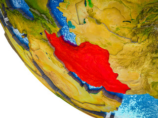 Iran on model of Earth with country borders and blue oceans with waves.