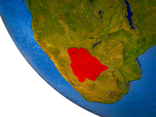 Botswana on model of Earth with country borders and blue oceans with waves.
