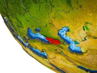 Georgia on model of Earth with country borders and blue oceans with waves.