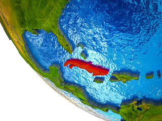 Cuba on model of Earth with country borders and blue oceans with waves.