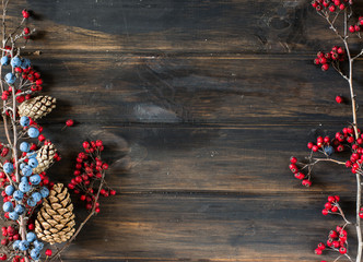 christmas background with copy space. New Year background with decorations. Cone, berries,...