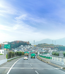 Obraz premium autumn colorful of Japan, maple leaves change color tree on the express highway road, road to yamanashi, japan