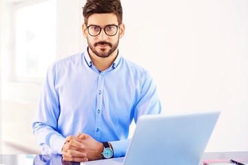 Businessman using his laptop in the office