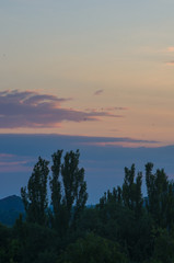 Obraz premium Landscape with dramatic light - beautiful golden sunset with saturated sky and clouds.