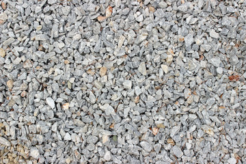Gravel pebble road surface texture background 