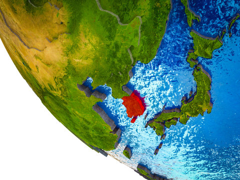 South Korea on model of Earth with country borders and blue oceans with waves.