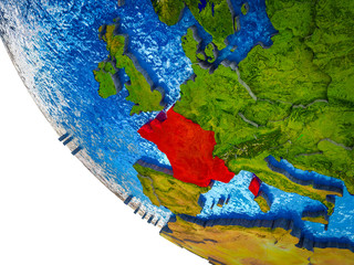 France on model of Earth with country borders and blue oceans with waves.