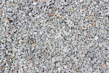 Gravel pebble road surface texture background 