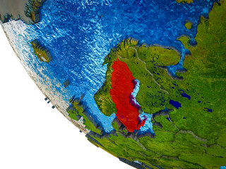 Sweden on model of Earth with country borders and blue oceans with waves.