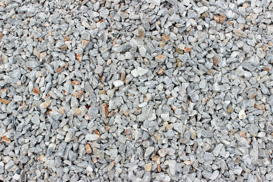 Gravel pebble road surface texture background 