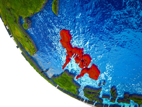 Philippines on model of Earth with country borders and blue oceans with waves.