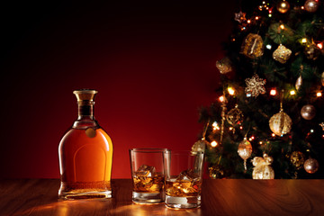 close up view  of glass with whiskey on color back