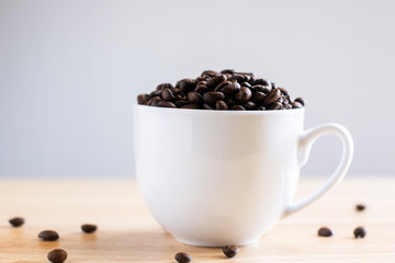 Coffee bean placed in a white cup