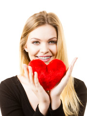 Woman holding red heart