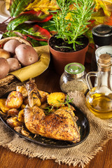 Roast chicken legs with baked potatoes