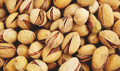 Salty pistachios background 