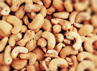 A lot of cashew nuts soft background. Tasty delicious healthy vegan snack. 